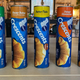 Different varieties of Pillsbury crescent rolls are lined up in a row